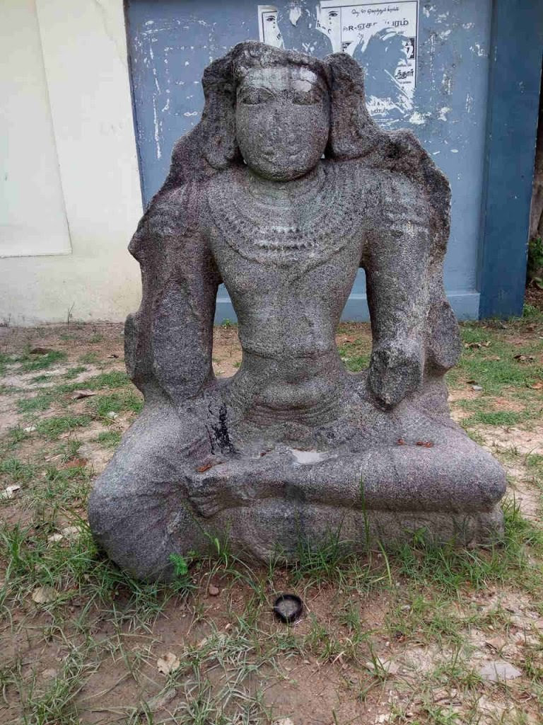 A broken statue in Enathur, Kanchi, which is possibly of Avalokitesvara.