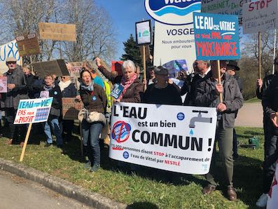 protest with 60 people holding sign in French to protect our water