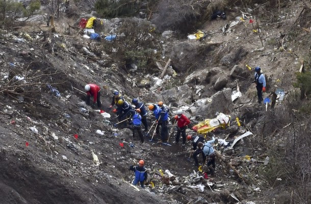 -- AFP PICTURES OF THE YEAR 2015 -- French gendarmes and investigators work on March 26, 2015 in the scattered debris on the crash site of the Germanwings Airbus A320 that crashed in the French Alps above the southeastern town of Seyne. The young co-pilot of the doomed Germanwings flight that crashed on March 24, appears to have