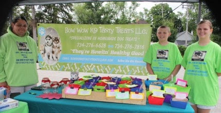Dogs and their owners can find fun things to buy at the Wednesday Bushel Basket Farmers Market.