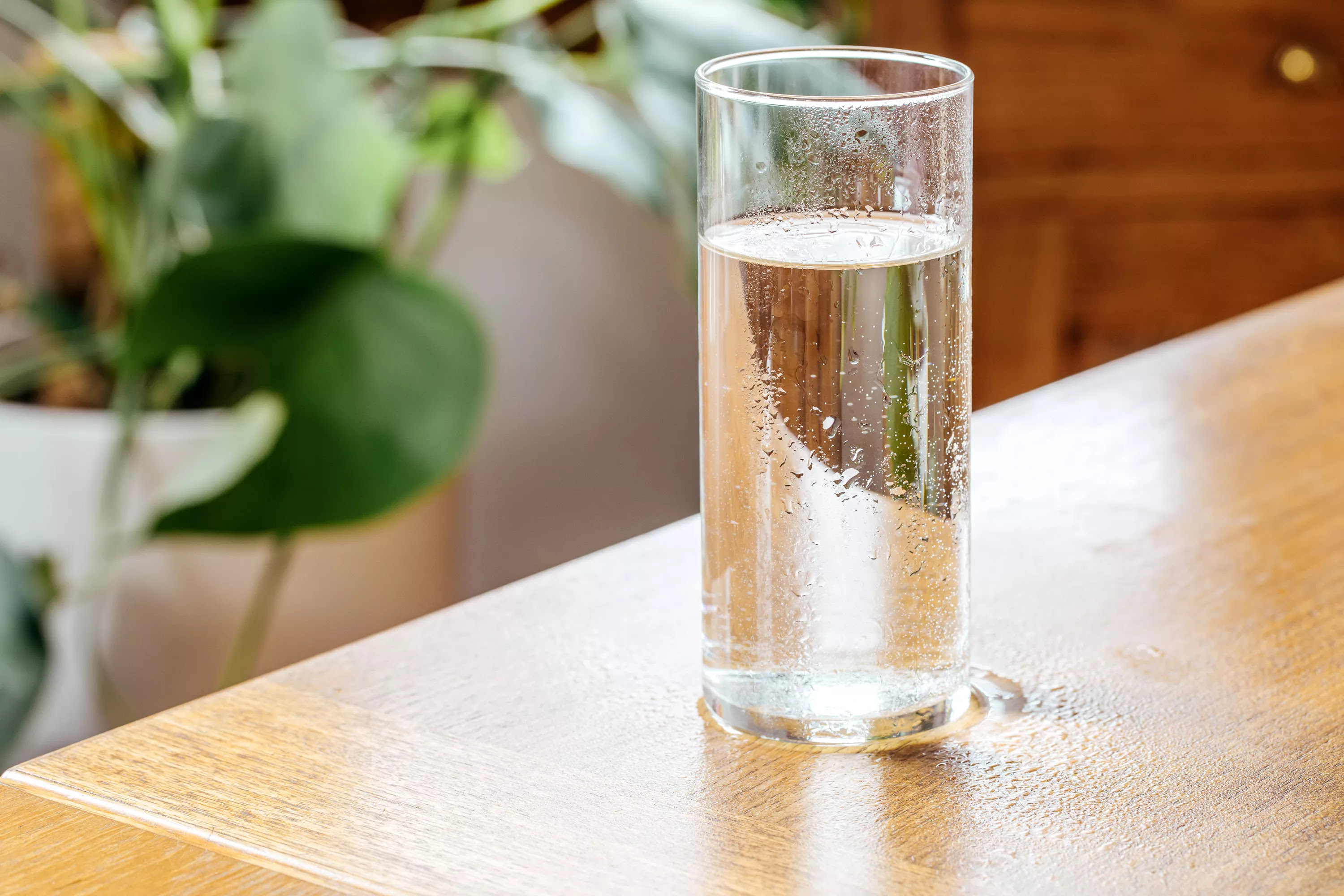 water glass creating water stain on wooden table