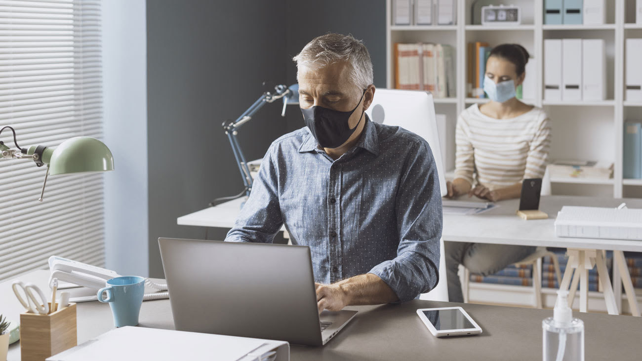 Office workers wearing face masks