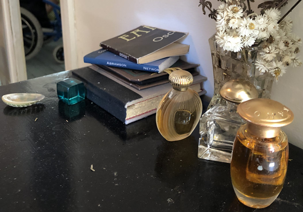 Books and Perfume Bottles on a desk