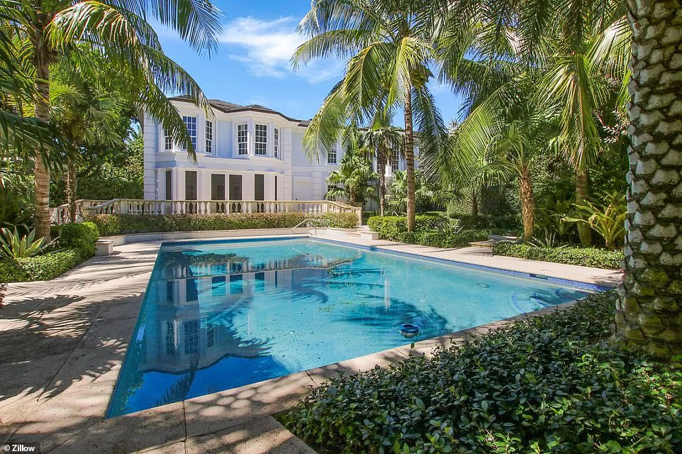 Photos show the cream-painted property also has a kitchen finished with marble counter tops, a private cinema, gym and swimming pool, and sits in 2.5 acres of landscaped grounds