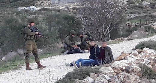 Soldiers pinning Ahmad Ziyadah to the ground and detaining his companions. Photo by Madama resident, 10 Feb. 2017