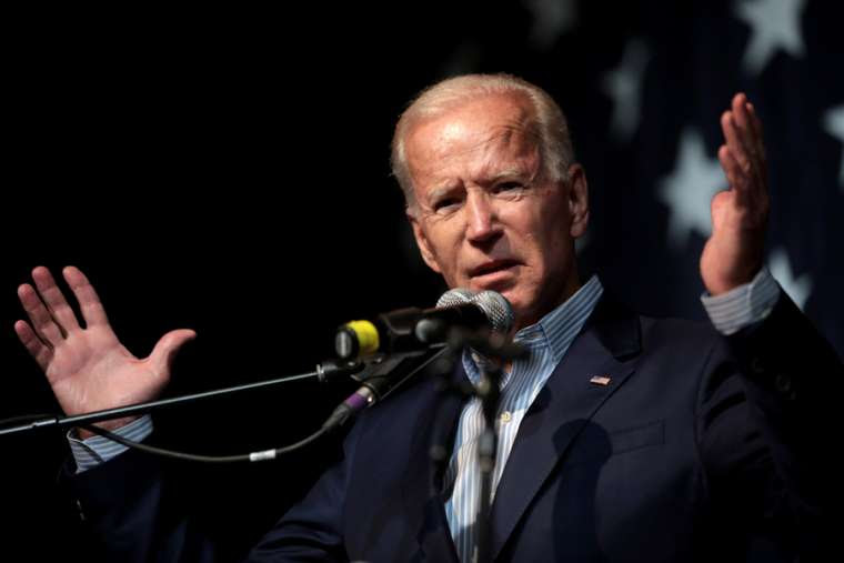 Biden with his arms outstretched