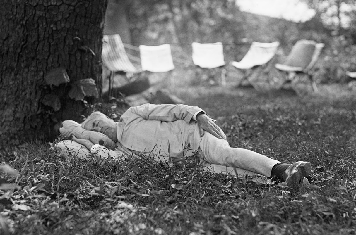 Thomas Edison naps under a tree