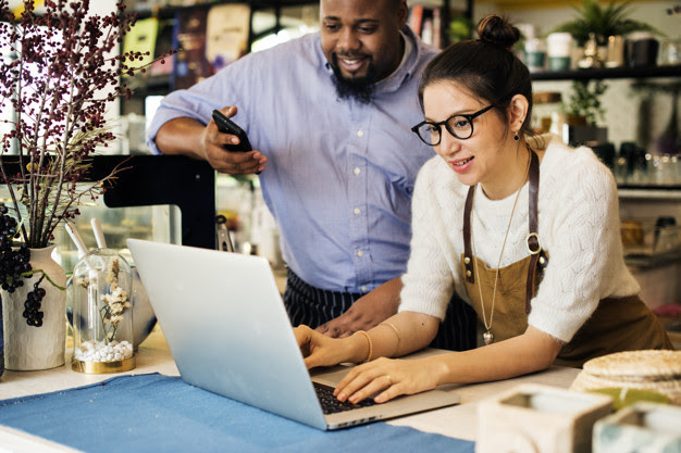 Small Business Owners with Laptop