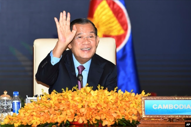FILE - In this photo provided by the An Khoun Sam Aun/National Television of Cambodia, Cambodian Prime Minister Hun Sen gestures as he joins an online meeting of the ASEAN-China special summit at Peace Palace in Phnom Penh, Cambodia on Nov. 22, 2021. (AP Photo)