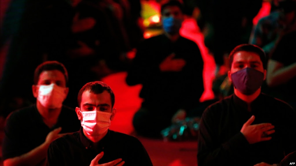 IRAN -- Iranian Shi'ite Muslims keep social distancing as they attend a mourning ritual to commemorate martyrdom of Prophet Mohammad's grandson Imam Hussein during the Islamic month of Muharram, at the shrine of Saleh in Tehran, August 27, 2020.