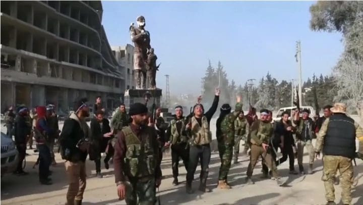 Turkish backed FSA rebels celebrate in Afrin City centre after sacking it