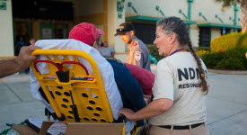 Image of NDMS volunteer with patient