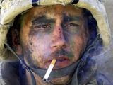 A member of Charlie Company of the U.S. Marines First Division, Eighth regiment, smokes a cigarette in Fallujah, Iraq, Tuesday, Nov. 9, 2004. U.S. forces punched into the center of the insurgent stronghold, overwhelming bands of guerrillas in the street with heavy barrages of fire and searching house to house in a powerful advance on the second day of a major offensive. (AP Photo/Los Angeles Times, Luis Sinco) ** FILE **