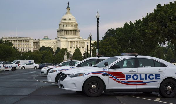 Washington Metropolitan Police vehicles hold on the perimeter of the Capitol in Washington, Thursday evening, Aug. 26, 2021. (AP Photo/J. Scott Applewhite) ** FILE **