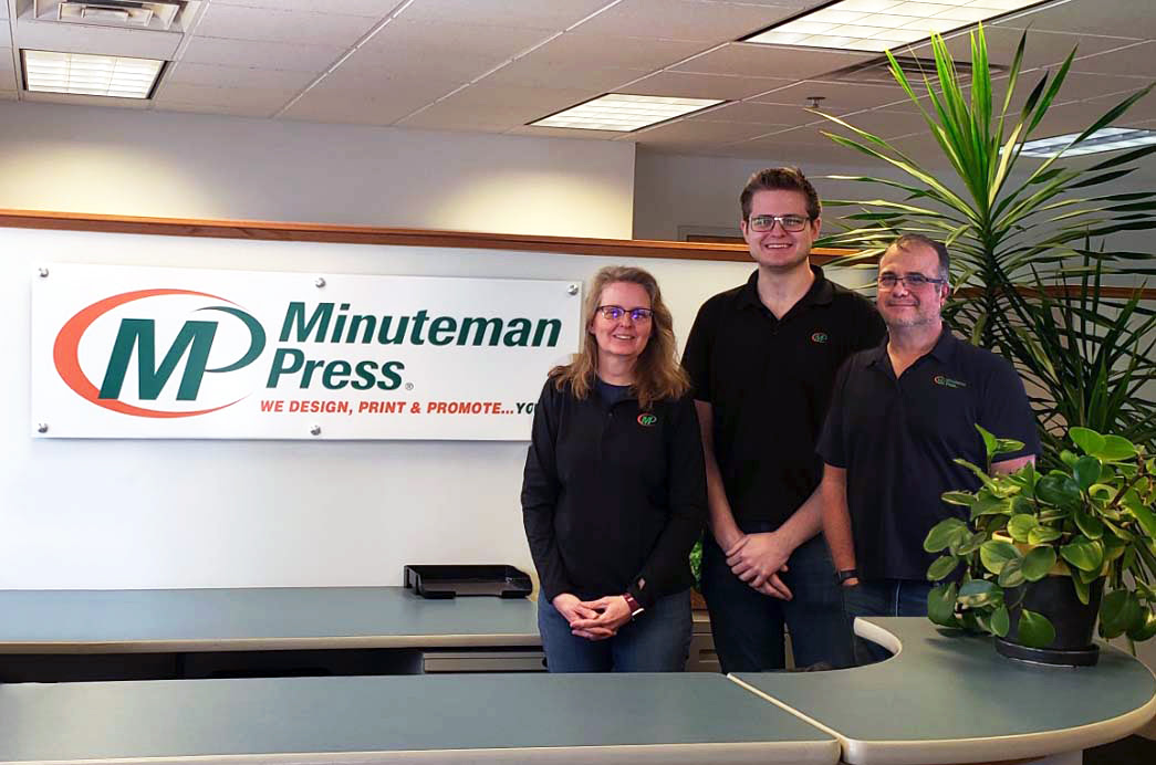 Meet the owners of Minuteman Press, Madison, WI. Pictured left to right: Lynn Kenney, CJ Kenney, and Chrispin Kenney. The Kenney family has also owned the Minuteman Press franchise in Waunakee, WI since 2013.