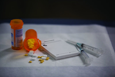 photo: pills, needles, and prescription pad