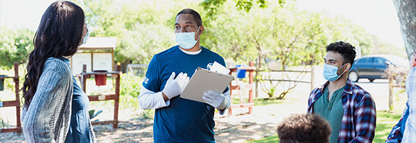 Community outreach volunteers wearing face masks