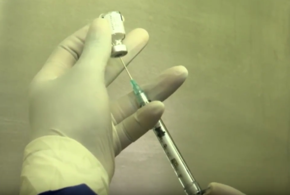 Lab tech preparing a vaccine