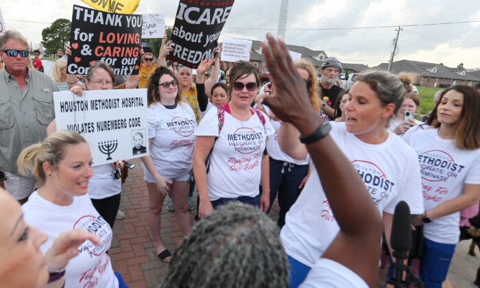 People gather to protest Houston Methodist Hospital system's rule of firing any employee who is not immunized by June 7, 2021, at Houston Methodist Baytown Hospital in Baytown, Texas. (Yi-Chin Lee/Houston Chronicle via AP)