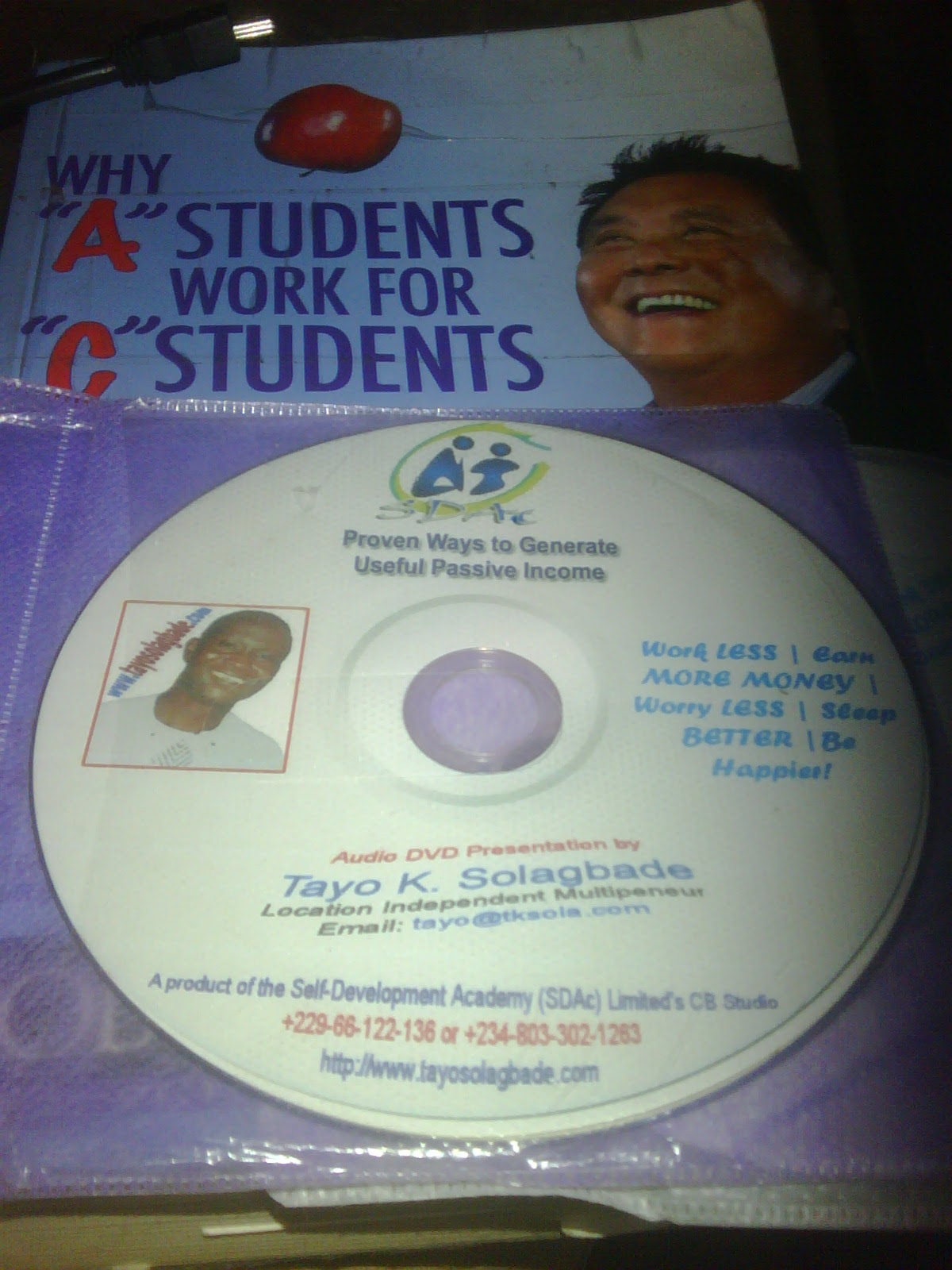 Photograph of my latest Audio DVD Information Product titled Proven Ways to Generate Useful Passive Income (sitting on my copy of Robert Kiyosaki's Why 'A' Students Work for 'C' Students, and 'B' Students Work for the Government)