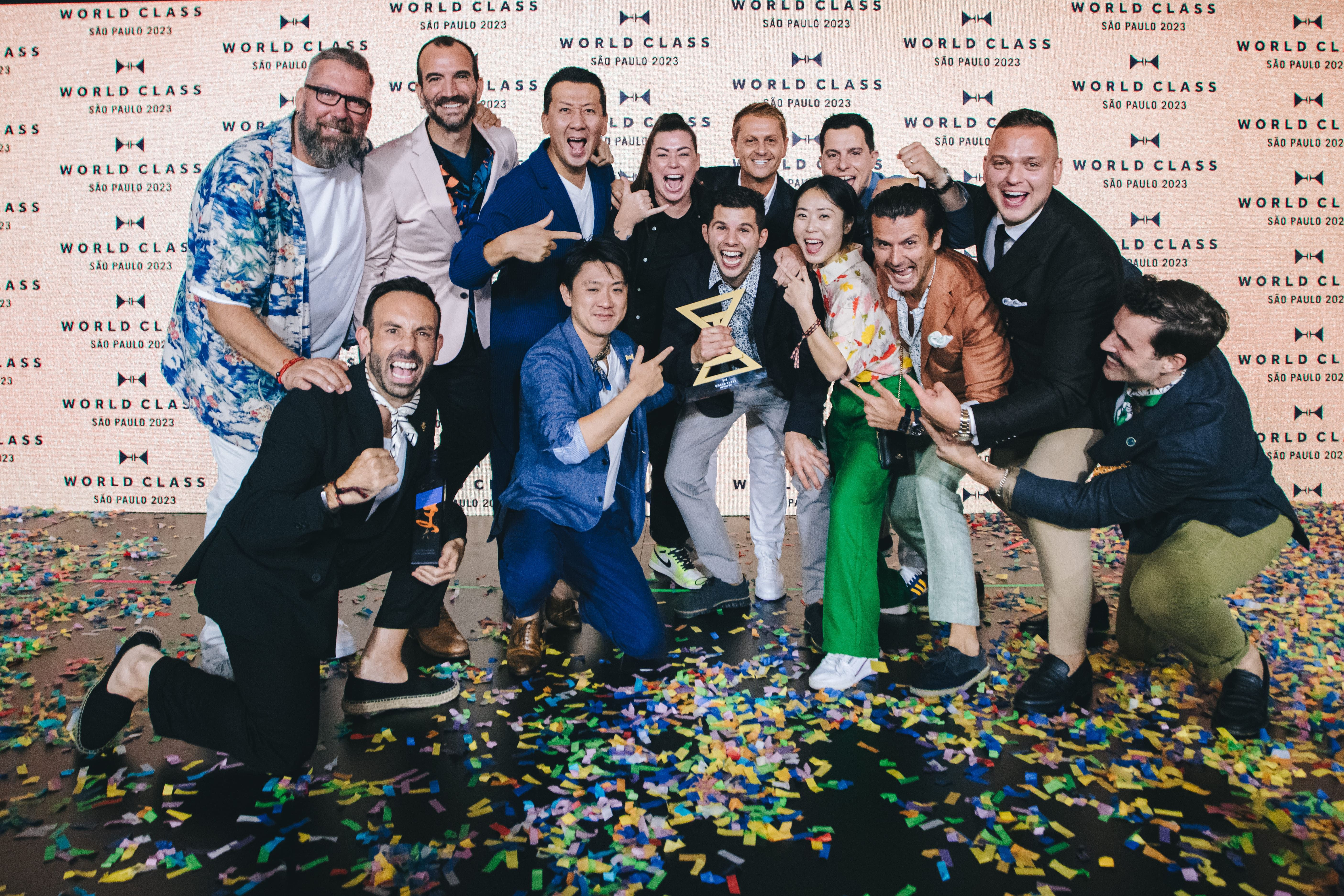 Jacob Martin from Canada is crowned winner of the World Class Global Bartender of the Year 2023 and celebrates with previous World Class winners.