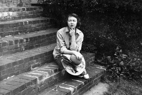 Flannery O’Connor sitting on the steps of her home in Milledgeville, Ga. in 1959.