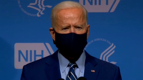 Biden Says Masks Should Be Worn 'Through the Next Year'