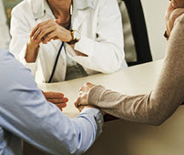 clinician talking to patients