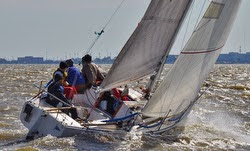 J/27 one-design sailboat- sailing upwind off New Orleans, LA