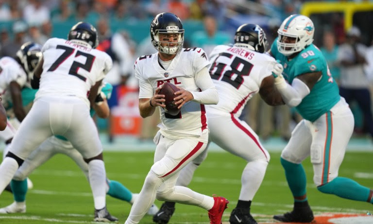 AJ McCarron drops back to pass for Falcons versus Dolphins in NFL preseason