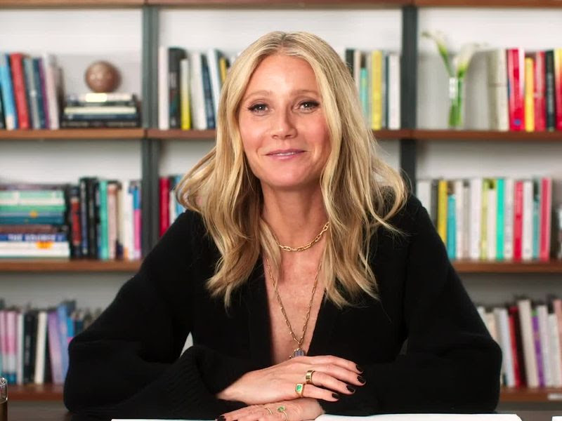 Image may contain: Furniture, Human, Person, Bookcase, Shelf, and Gwyneth Paltrow