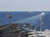 In this Tuesday, Nov. 19, 2019, photo made available by U.S. Navy, a helicopter lifts off of the aircraft carrier USS Abraham Lincoln as it transits the Strait of Hormuz. The U.S. aircraft carrier Abraham Lincoln sent to the Mideast in May over tensions with Iran transited the narrow Strait of Hormuz for the first time on Tuesday. The ship previously had been in the Arabian Sea outside of the Persian Gulf. (Mass Communication Specialist Seaman Stephanie Contreras/U.S. Navy via AP) **FILE**