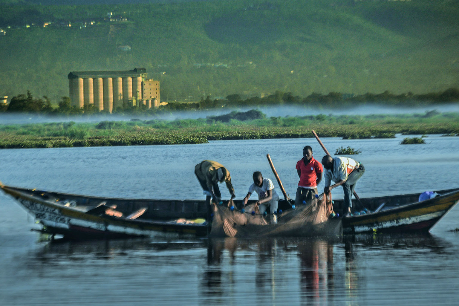 Fishermen gathering their catch early in the morning on Lake Victoria.