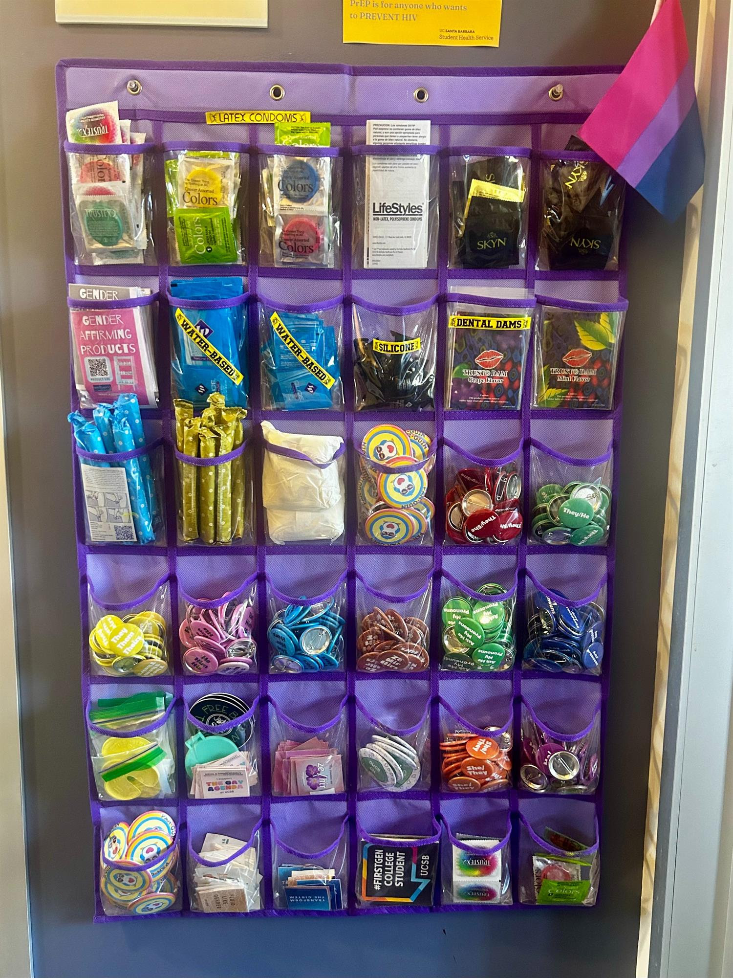 An organizer on a wall with pockets that hold items