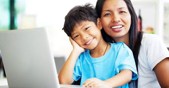 mother and son at a computer