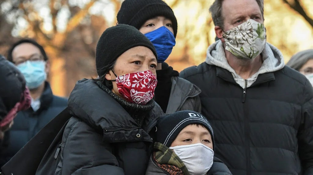 People participate in a peace vigil to honor victims of attacks on Asians on March 19, 2021 in Union Square Park in New York City