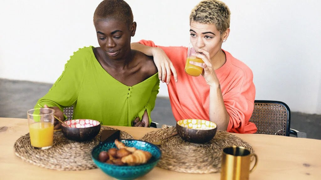 Two women having breakfast together at home representing sickness after eating