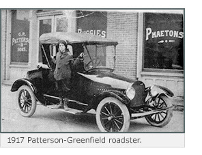 A child leans out of a 1917 Patterson-Greenfield roadster.
