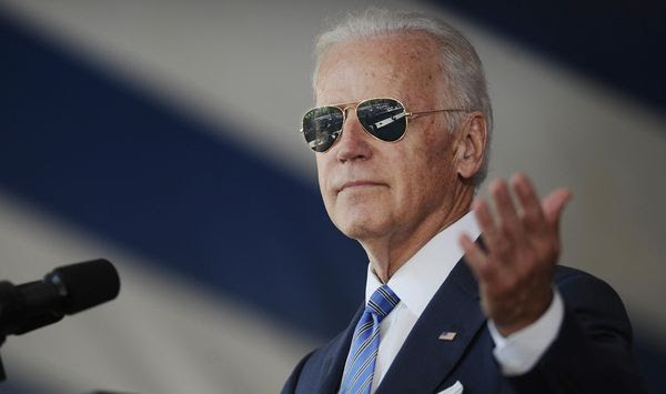 In this May 17, 2015, file photo, Vice President Joe Biden gestures after donning a pair of sunglasses as he delivers the Class Day Address at Yale University in New Haven, Conn. (AP Photo/Jessica Hill, File)
