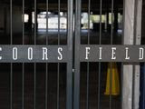 The main gate of Coors Field, home of the Major League Baseball team the Colorado Rockies, is locked early Tuesday, June 23, 2020, in Denver. The league is waiting for the players&#39; union to respond Tuesday to whether it will agree to health protocols for a 60-game regular-season slate and if players will report for training camp by July 1. (AP Photo/David Zalubowski)
