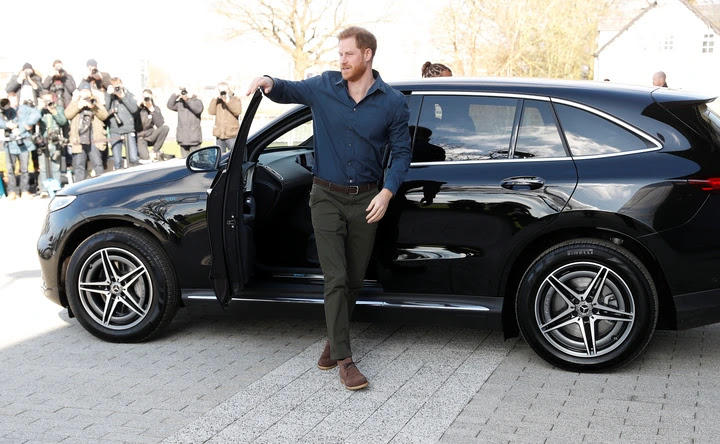  Harry jumps out of an electric Mercedes as he arrives as the Silverstone event