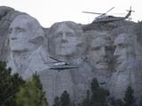 Marine One, with President Donald Trump, flies past Mount Rushmore National Memorial, Friday, July 3, 2020, near Keystone, S.D. (AP Photo/Alex Brandon)