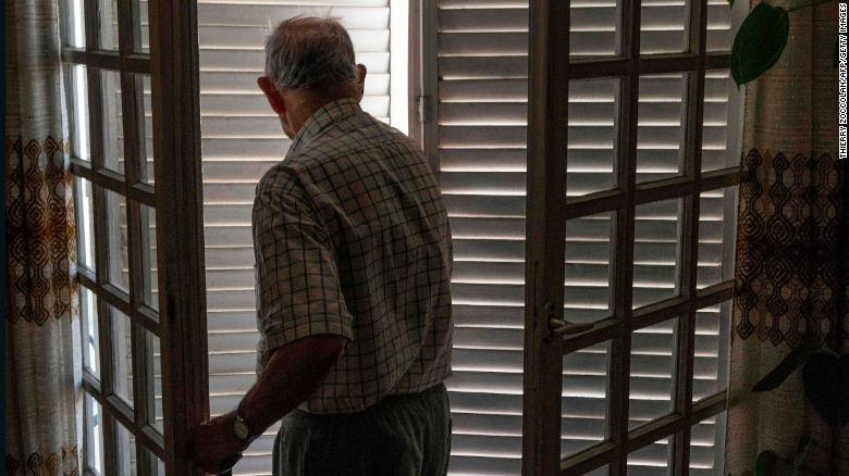 An elderly person (not involved in the research) closes his shutters to keep cool during the heatwave in Clermont-Ferrand, France, on June 25, 2019.