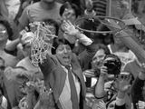 In this April 4, 1983 file photo, North Carolina State coach Jim Valvano holds the net aloft after his team defeated Houston 54-52 for the national championship at the Final Four NCAA college basketball tournament in Albuquerque, N.M. (AP Photo/Leonard Ignelzi, File) **FILE**