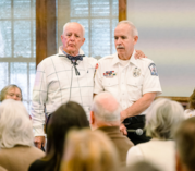 Image of Chairman Woodard standing with EMT Bill Laricos.
