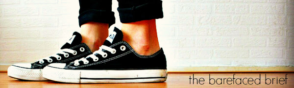feet in converse sneakers