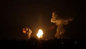 Smoke and fireball rises following an air strike in Khan Yunis in the southern Gaza Strip, early on Sunday.