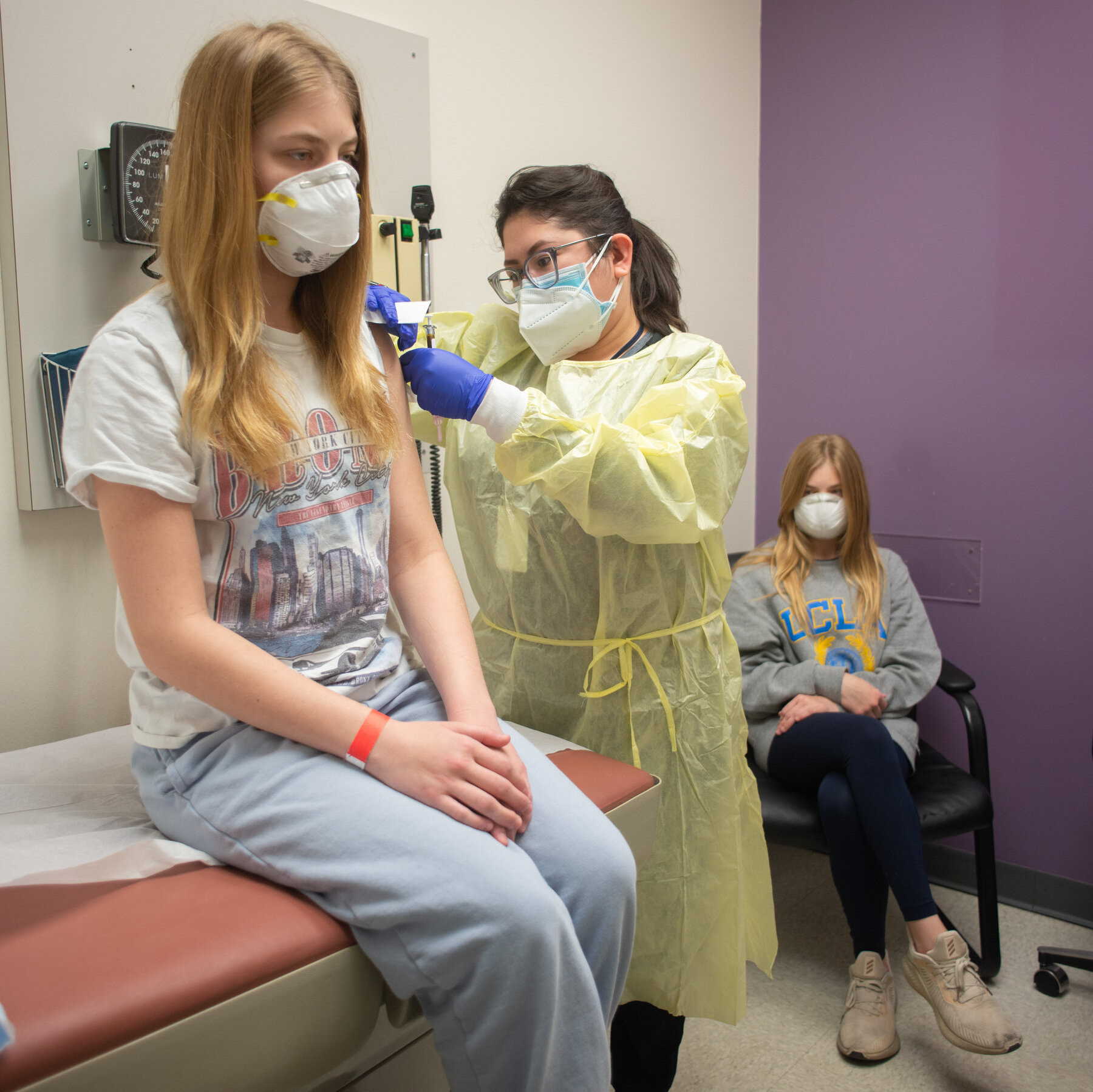 Teen getting a vaccine