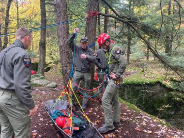 Rangers at rope rescue training in the woods