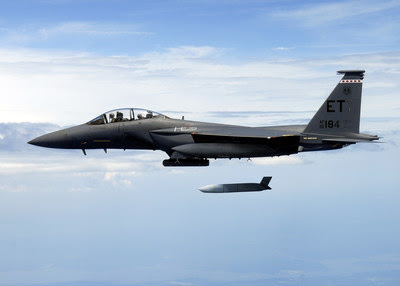 A U.S. Air Force F-15E Strike Eagle flies with a Joint Air-to-Surface Standoff Missile (JASSM). JASSM-Extended Range has more than two-and-a-half times the range of JASSM for greater standoff distance. Photo credit: U.S. Air Force. A U.S. Air Force F-15E Strike Eagle flies with a Joint Air-to-Surface Standoff Missile (JASSM). JASSM-Extended Range has more than two-and-a-half times the range of JASSM for greater standoff distance. Photo credit: U.S. Air Force.